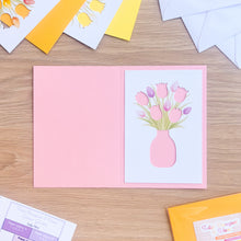 Load image into Gallery viewer, Pink card blank with tulip aperture on a wooden surface
