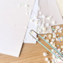 Load image into Gallery viewer, close-up of a crystal gem held by tweezers
