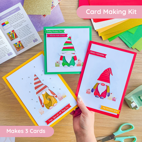 Gonk or gnome card making kit with greeting cards and supplies on a wooden surface