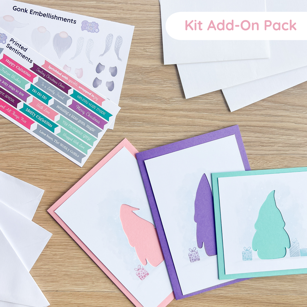 Greeting cards with envelopes, inserts and  embellishments on a wooden surface, featuring 'Kit Add-On Pack' text.
