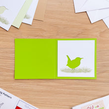 Load image into Gallery viewer, Wren aperture on bright green card blank.
